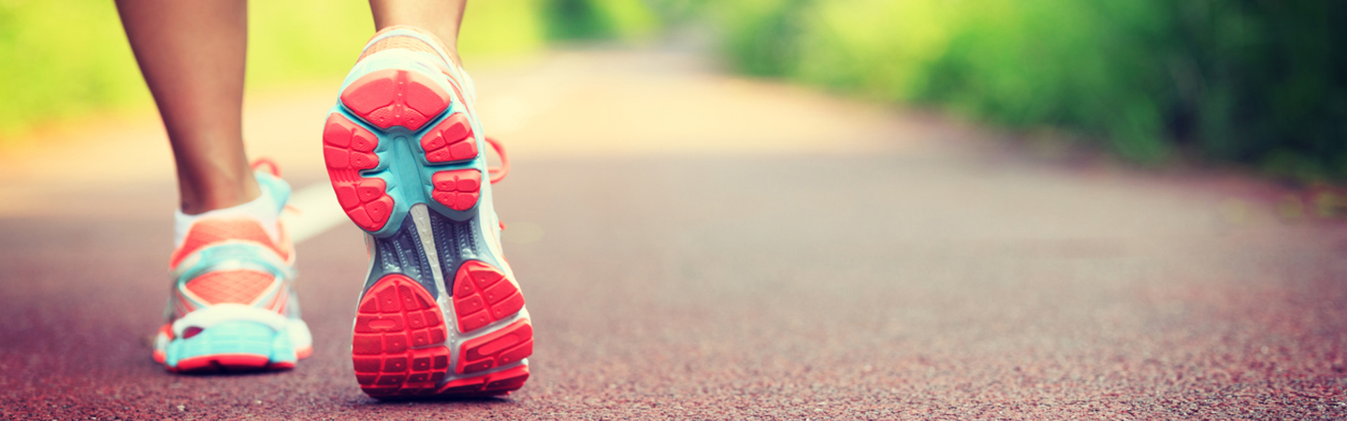 a person wearing running shoes outdoors