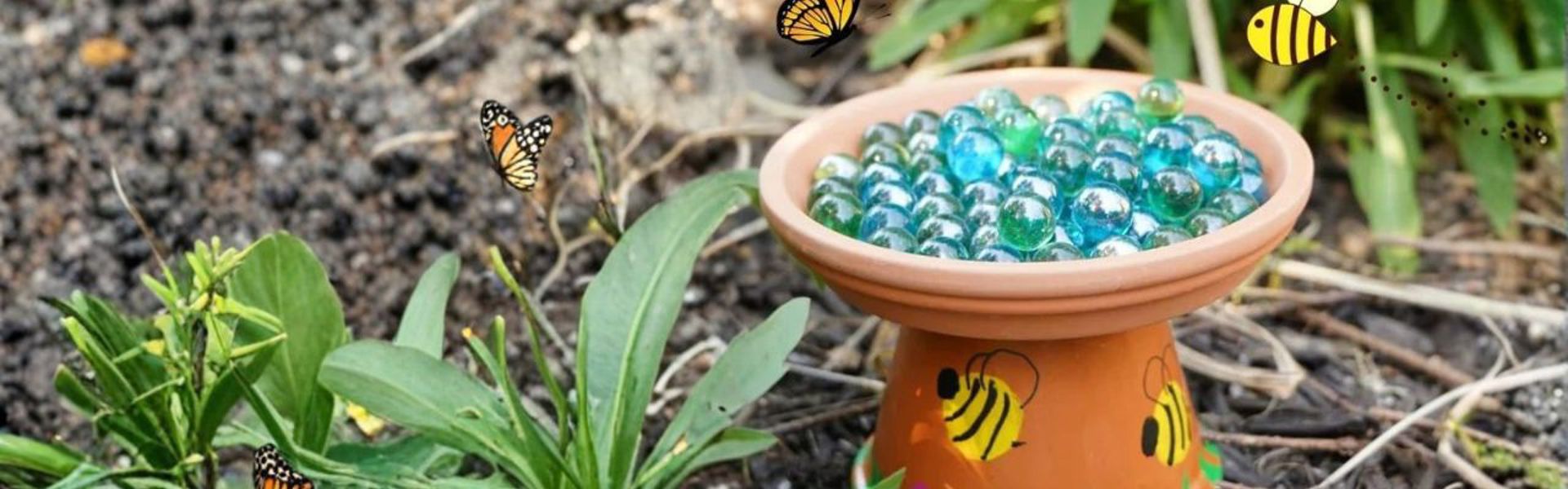 Main image: a DIY bee bath for the garden, made from a terracotta pot and saucer with marbles for the bees to land on. With cute yellow bees painted on the side.