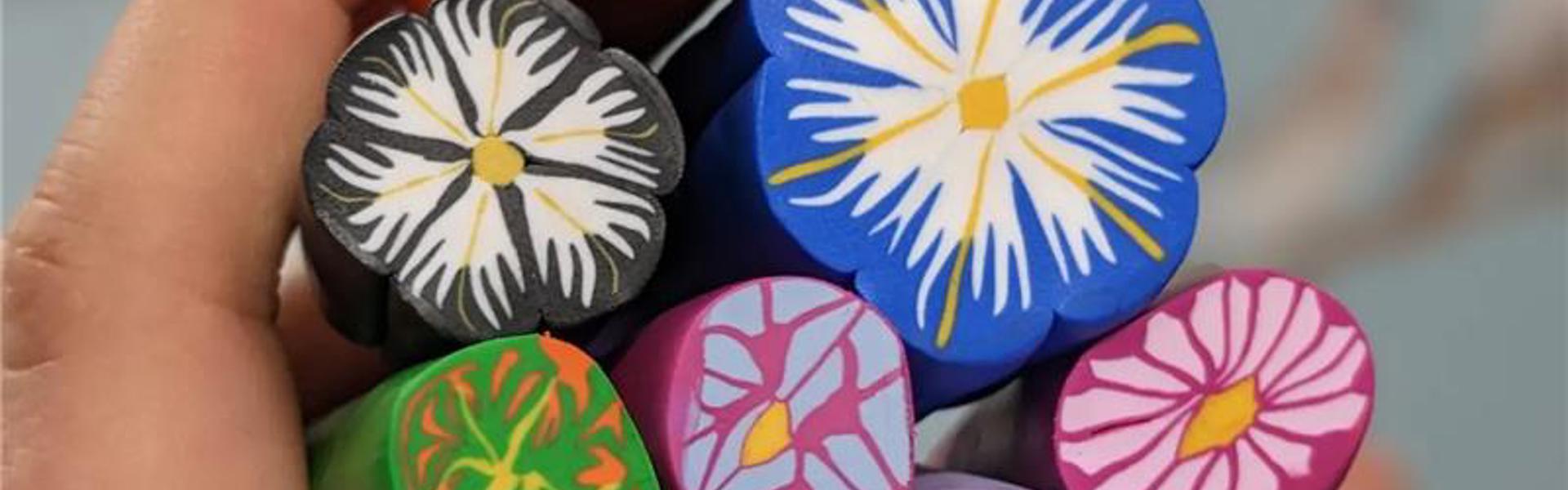 Main image: polymer clay canes, in multicolours, with a flower type pattern (or millefiori patterns) used for making jewellery pendants, for earrings, necklaces, keyrings and more.