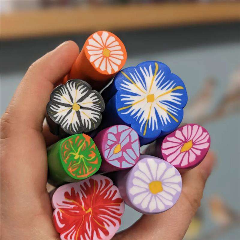 Main image: polymer clay canes, in multicolours, with a flower type pattern (or millefiori patterns) used for making jewellery pendants, for earrings, necklaces, keyrings and more.