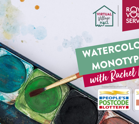 a watercolour paint tray with a paint brush resting on the side