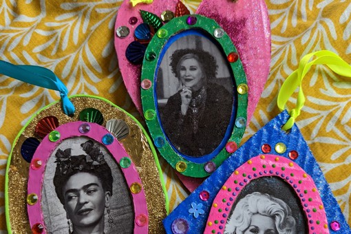 colourful embellished collage carboard decorations featuring pictures of Frida Kahlo, Dolly Parton and Catherine O'Hara