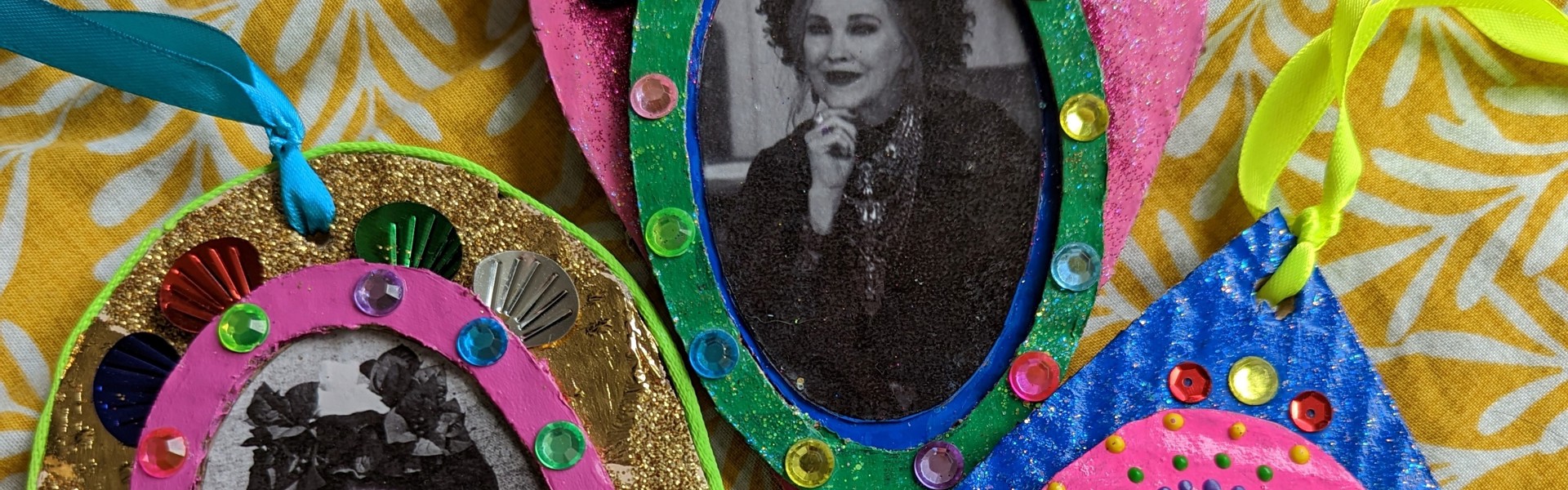 colourful embellished collage carboard decorations featuring pictures of Frida Kahlo, Dolly Parton and Catherine O'Hara