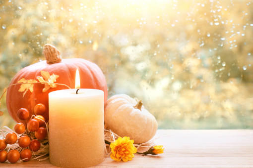 Autumnal items and a candle 