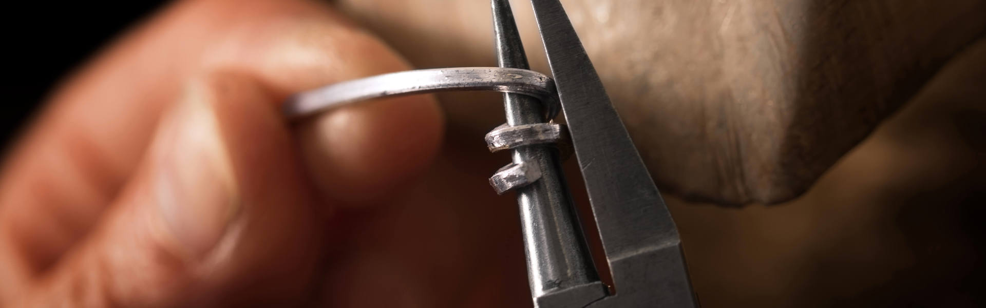 a close up of someone using wire tools to bend the wire