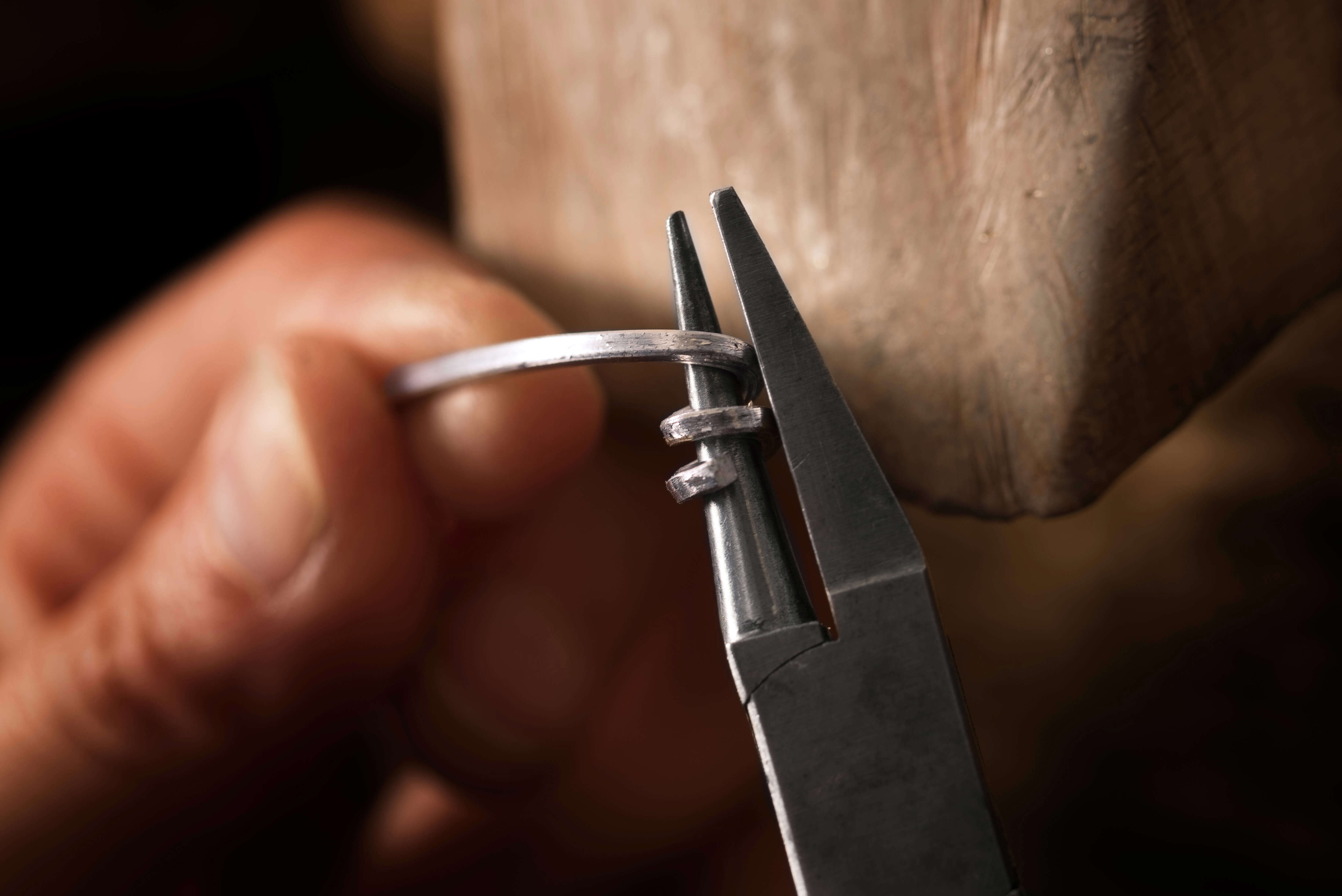 a close up of someone using wire tools to bend the wire