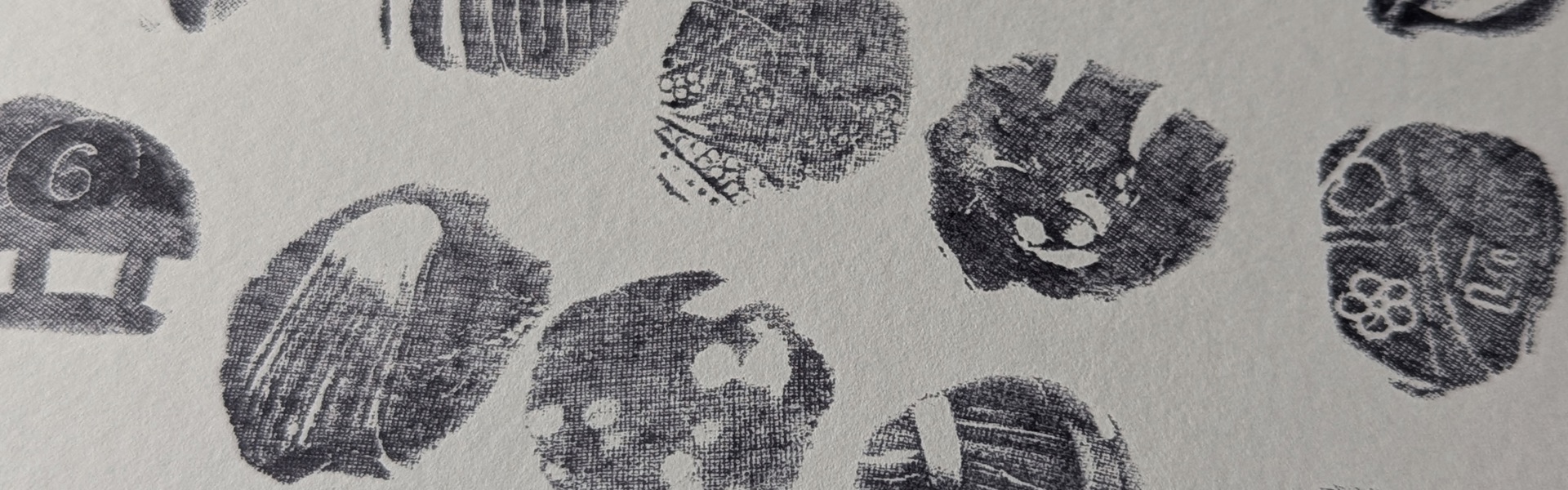 Main image: abstract art, made with playdoh stamps and ink - abstract stamp shapes in black ink on white paper.