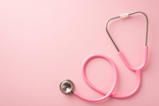 a pink stethoscope on a pink background