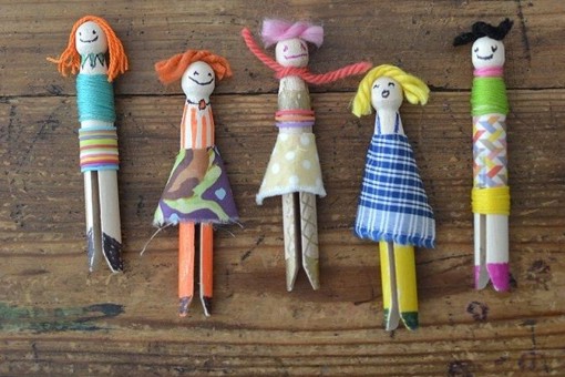 multicoloured peg dolls made from clothes pegs and scraps of fabric by Kate Nisbet