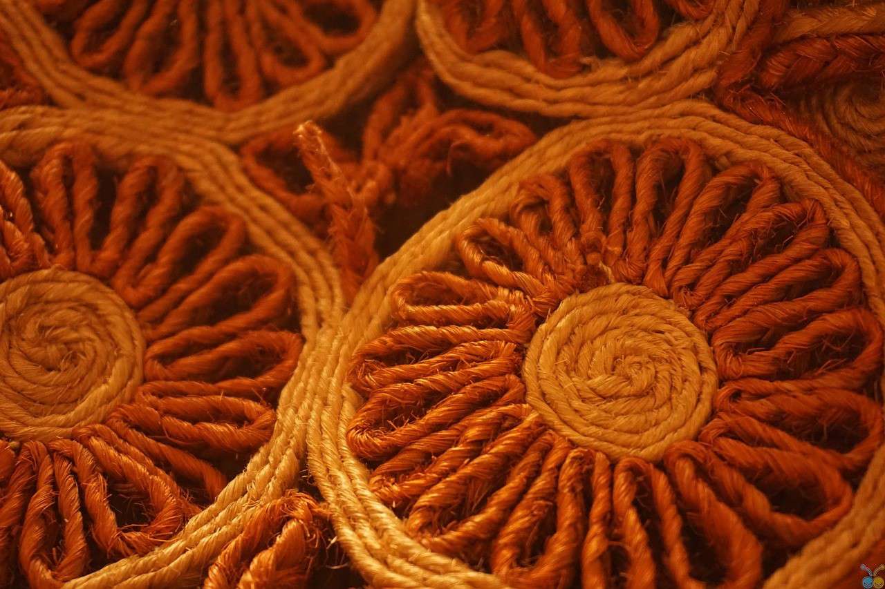 a close up of orange brown and red rustic outdoor table settings made by Rachel Moore