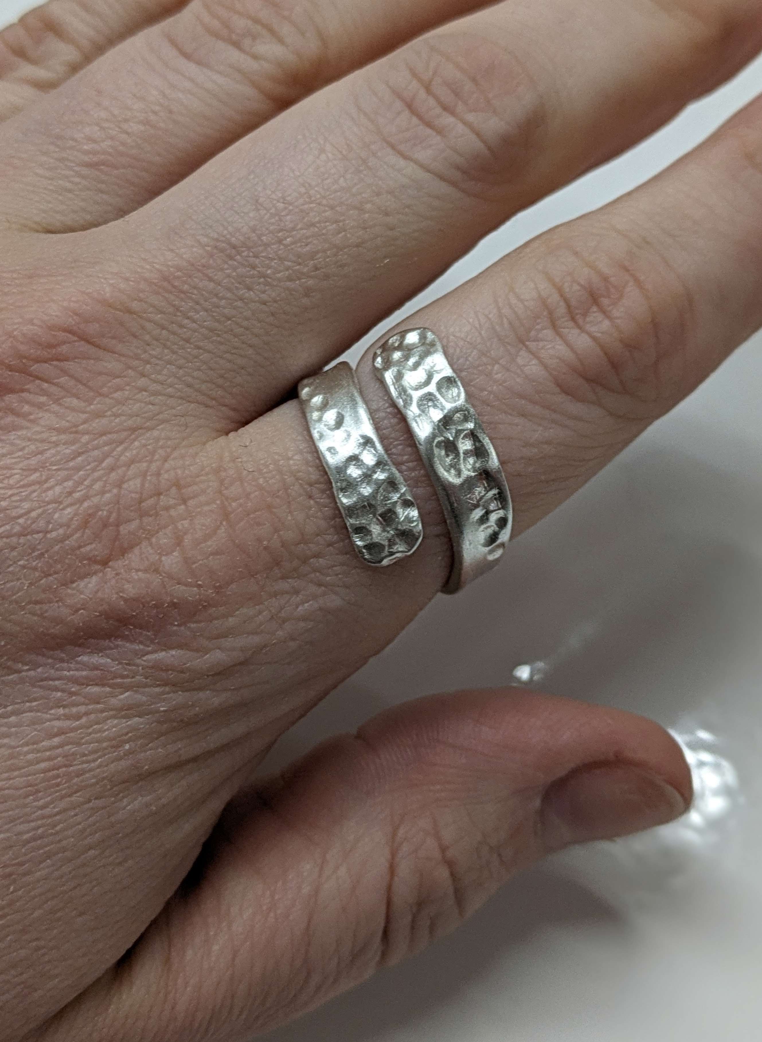 Main image: a handmade, adjustable silver clay ring, with textured details.