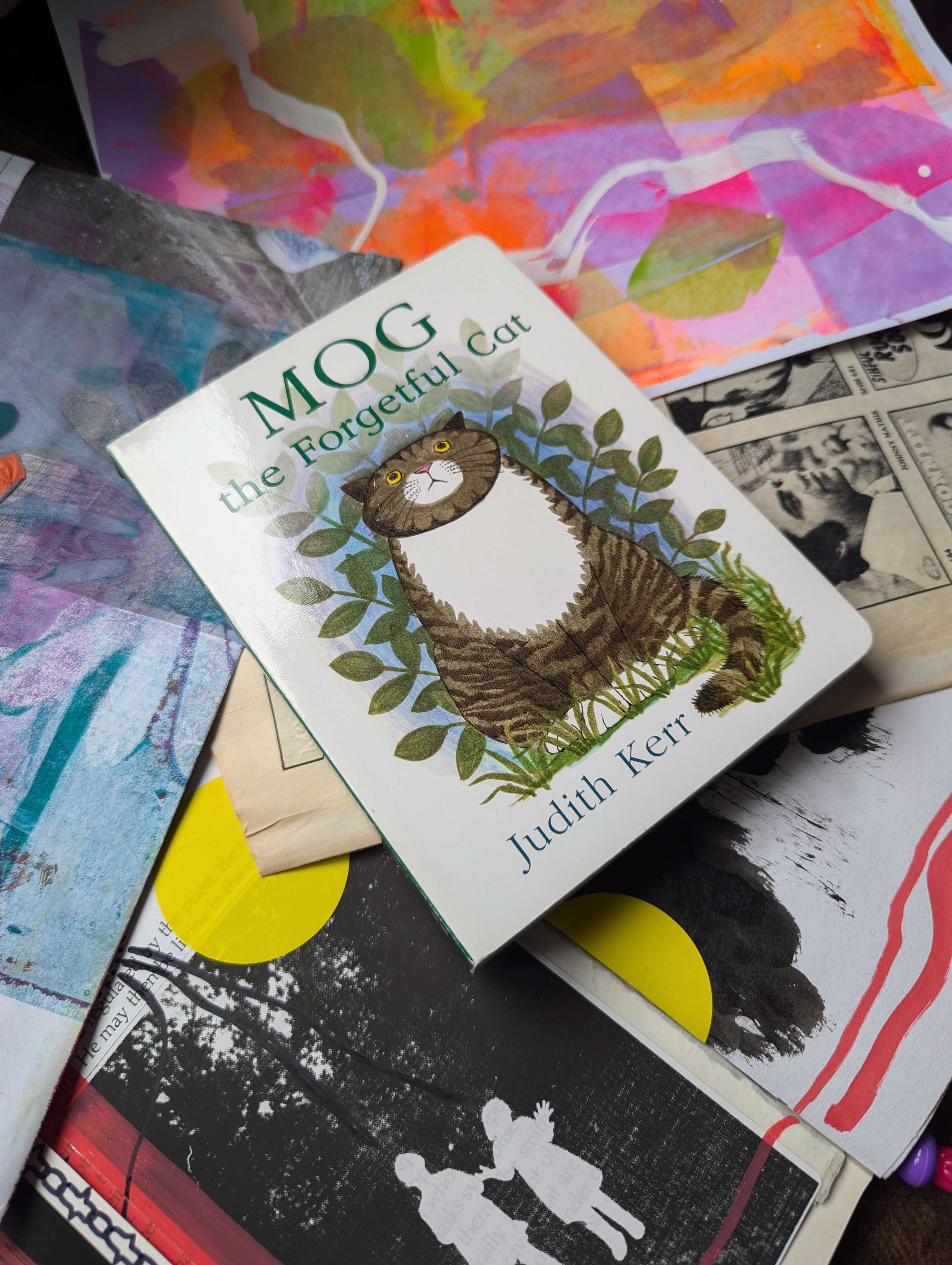 Main Image: A baby board book collage journal, the cover of the book is a grey tabby cat, with the title "Mog the Forgetful Cat, Judith Kerr"