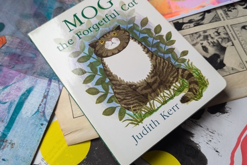 Main Image: A baby board book collage journal, the cover of the book is a grey tabby cat, with the title "Mog the Forgetful Cat, Judith Kerr"