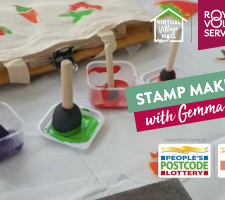 Homemade stamp making tools on a white table cloth in various primary colour paints