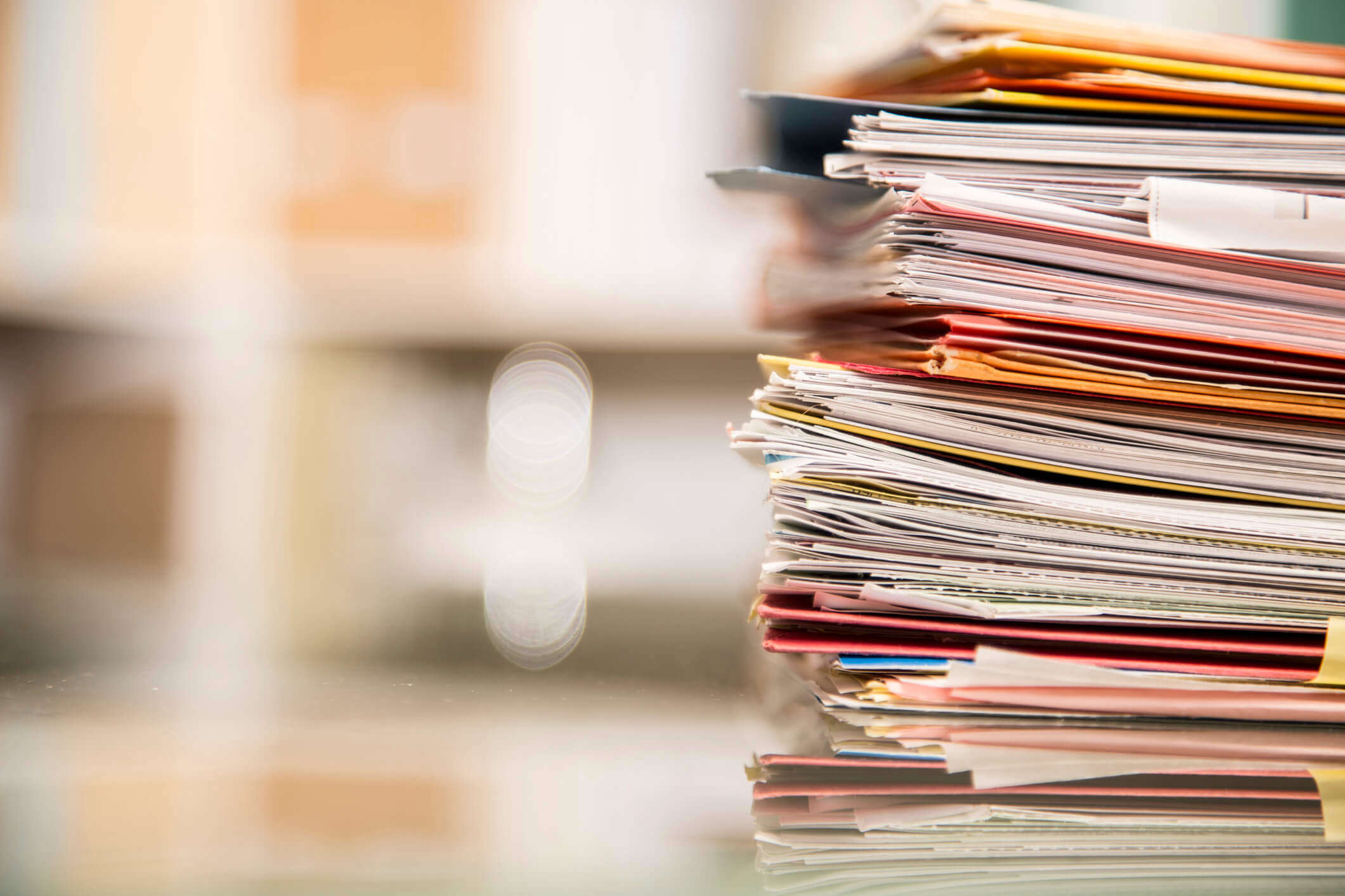 a close up of a stack of scrap paper on a work table