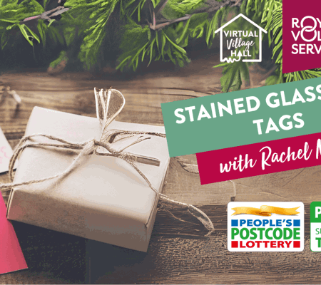 a christmas gift wrapped in brown parcel paper with brown and red gift tags next to it