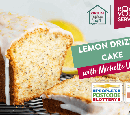 a lemon and poppy seed drizzle cake on a cooling rack surrounded by lemons