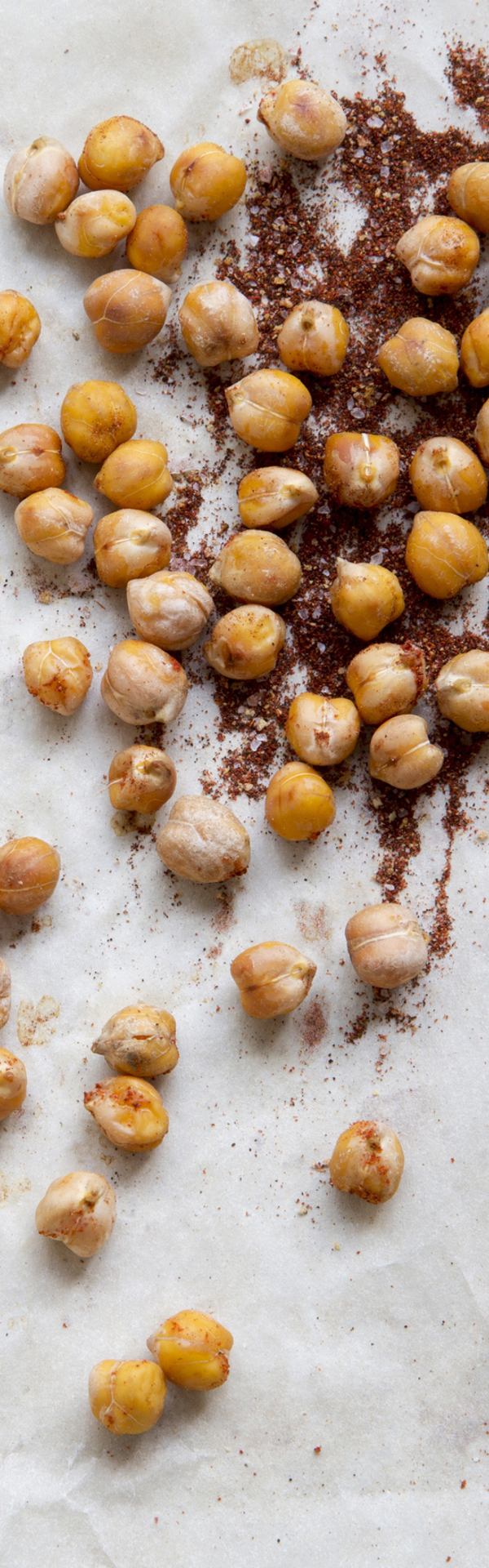 Main image: chickpeas and spices on greaseproof paper, ready to make a healthy snack - crispy chickpea biscuits.