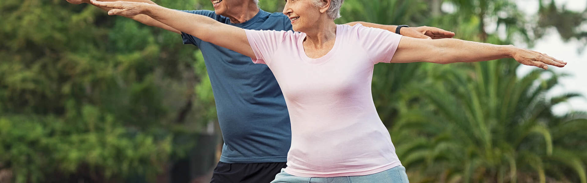 Two older people working out 