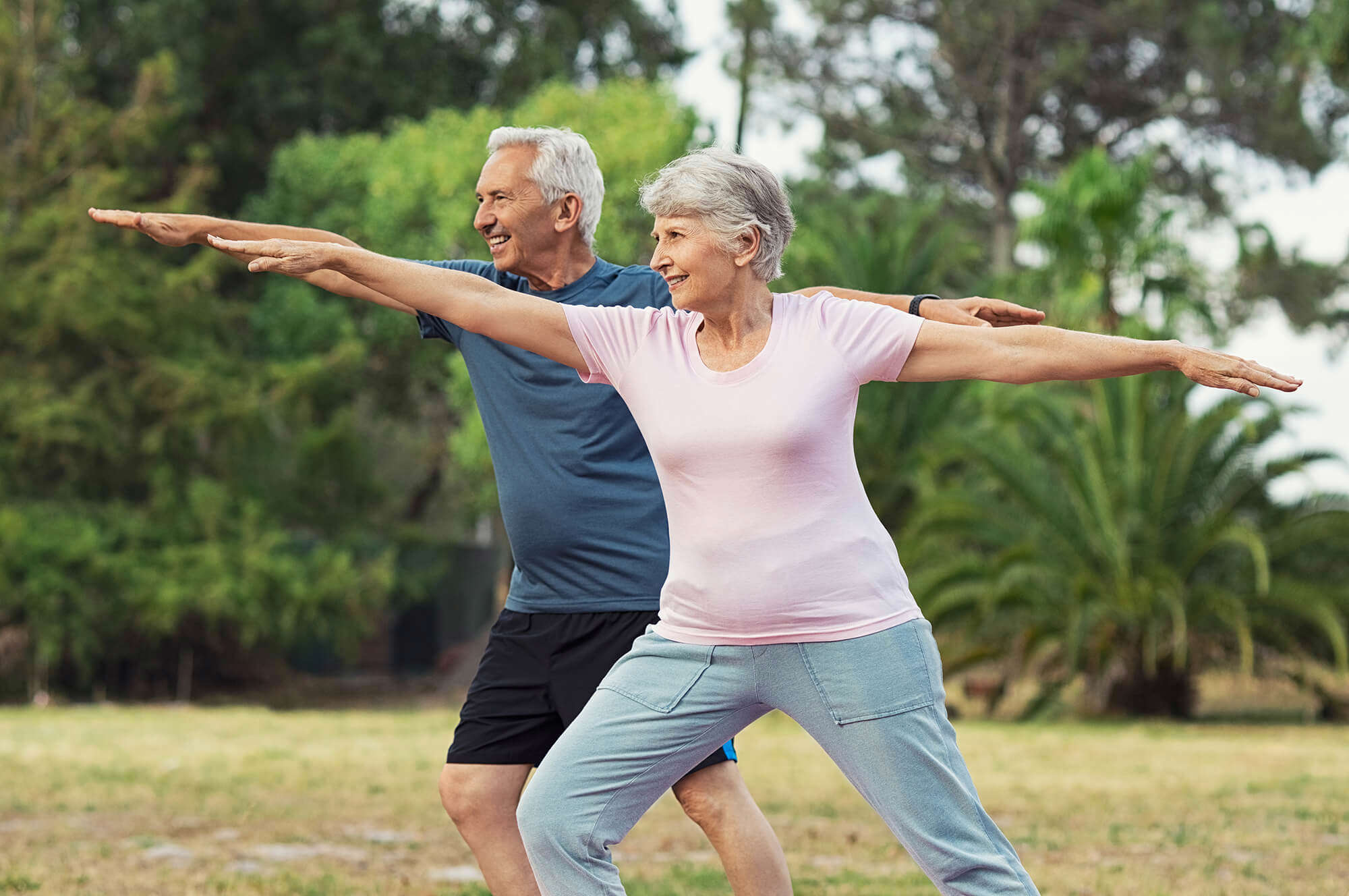 Two older people working out 