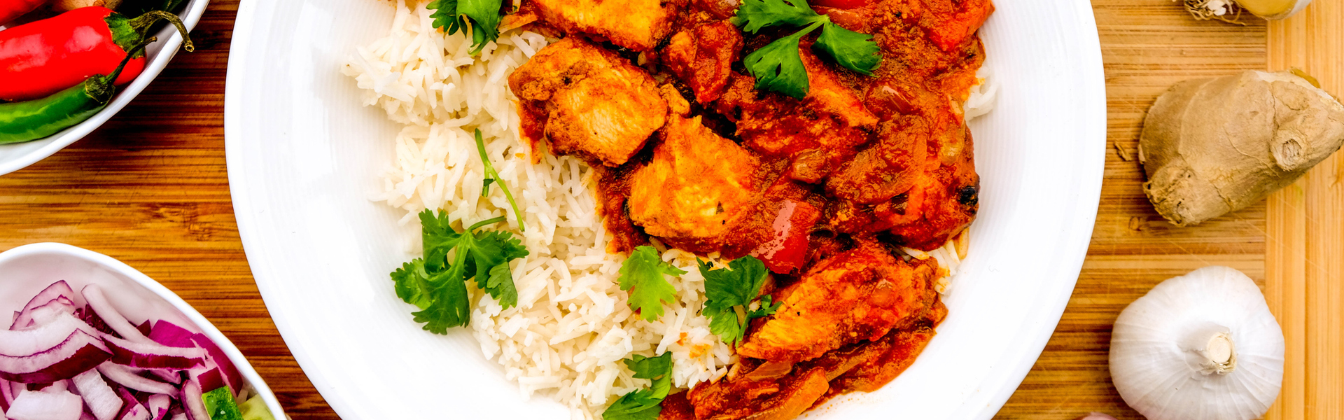 Main image: Pork Fillet Jalfrezi with rice and coriander garnish, on a wooden table with ingredients.