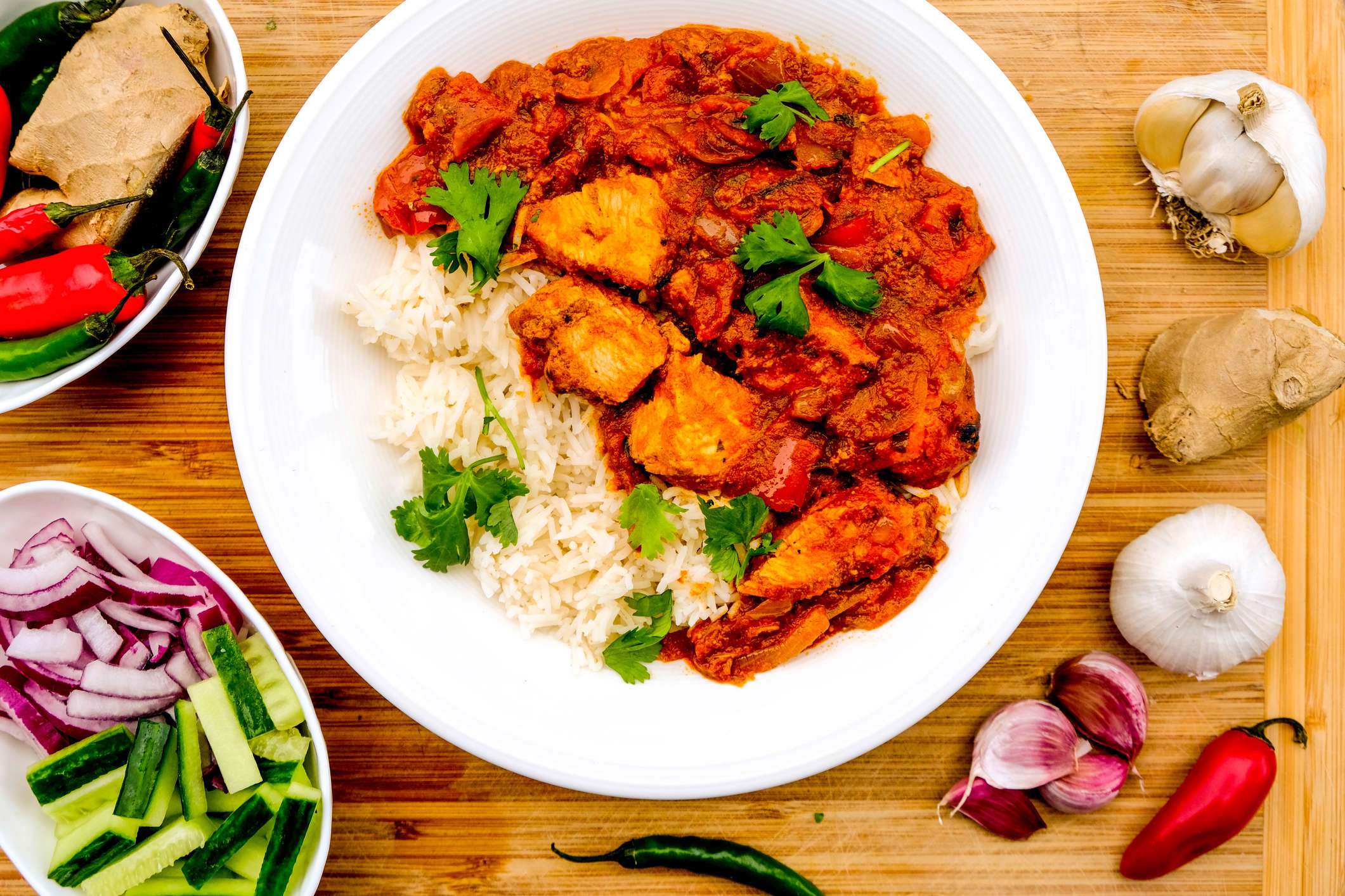 Main image: Pork Fillet Jalfrezi with rice and coriander garnish, on a wooden table with ingredients.