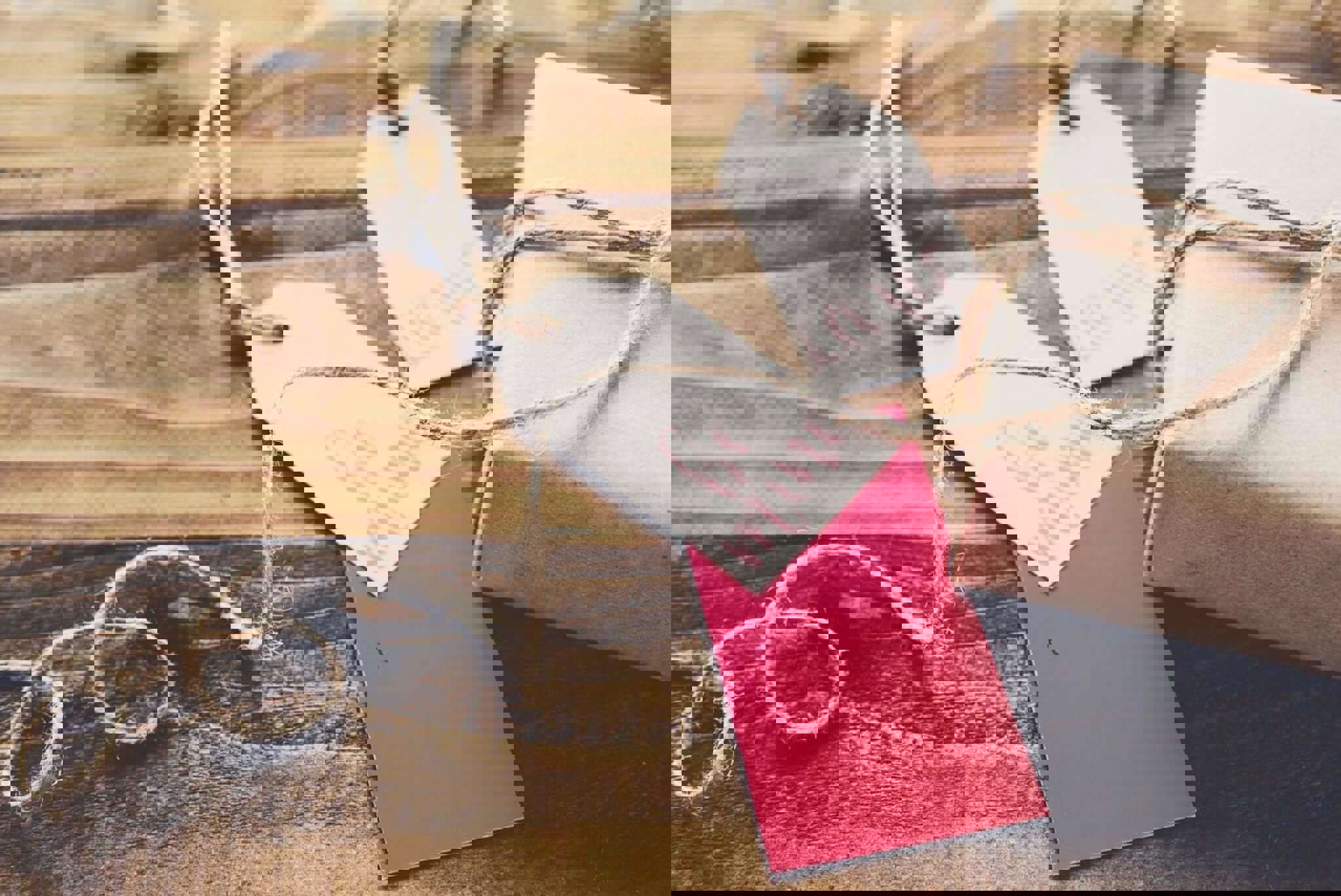 a present wrapped in brown parcel paper with a red gift tag next to it