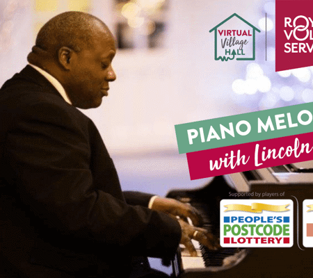 Pianist Lincoln Noel sat at a black grand piano with Christmas lights in the background