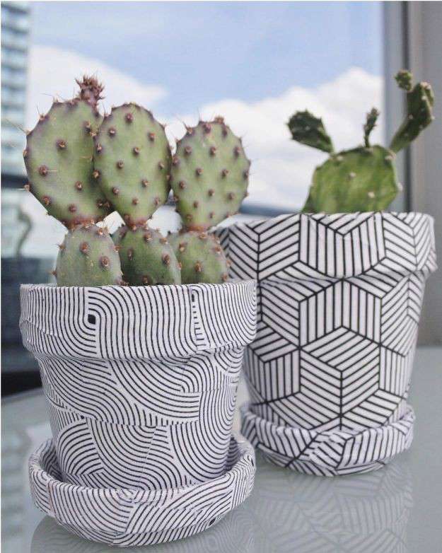 a close up of a black and white geometric pattern plant pot