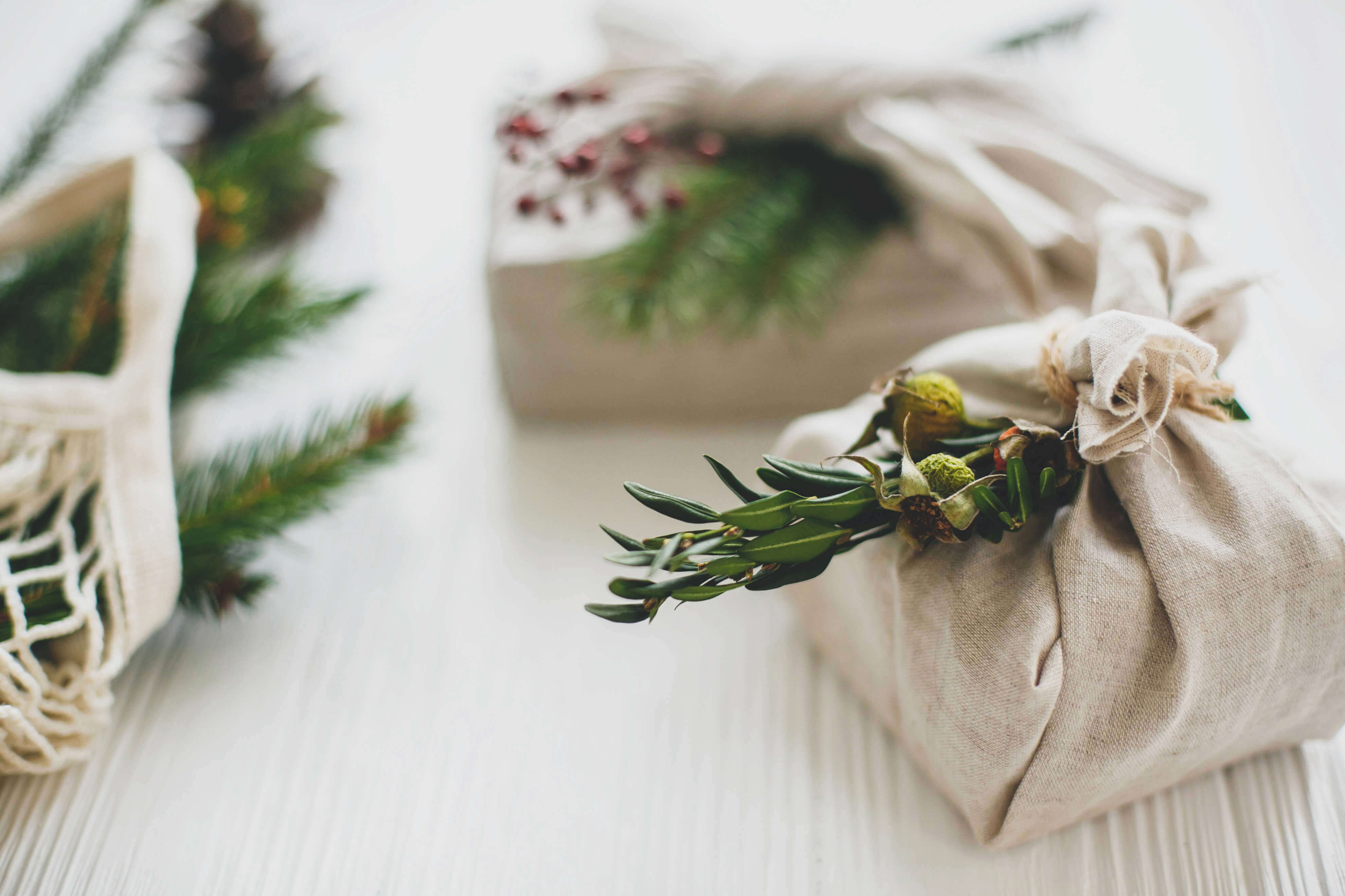 Eco friendly gift wrapped presents with Christmas tree decorations