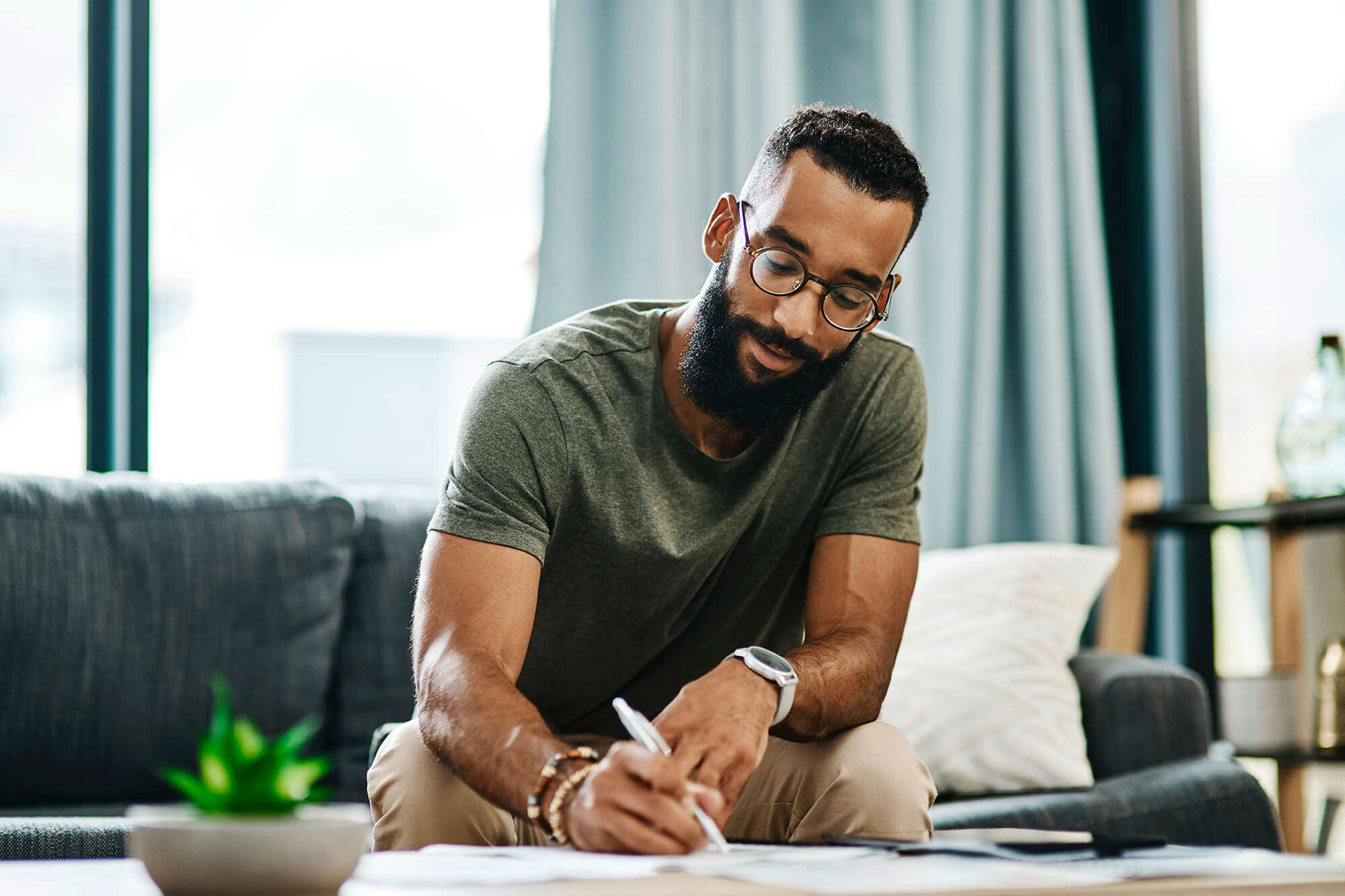 A young man writing in a note book