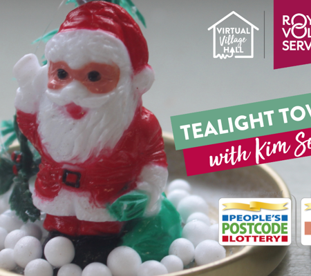 a close up of an upcycled jam jar lid with a small Santa figurine fixed to the top