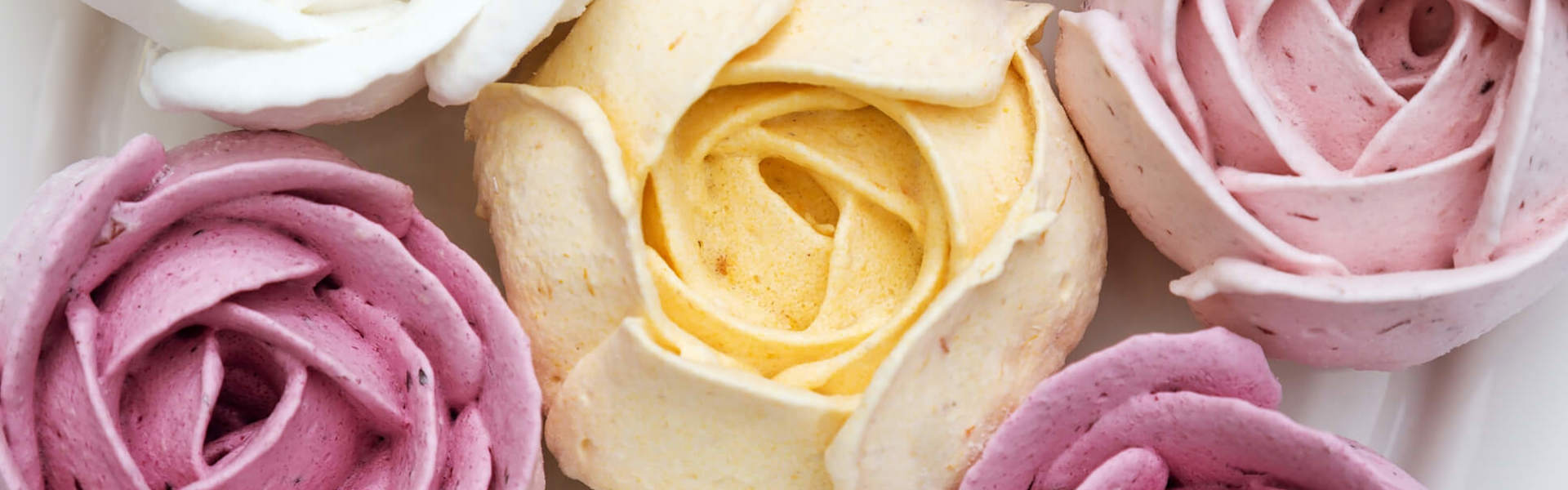 pink white and yellow sugar paste roses