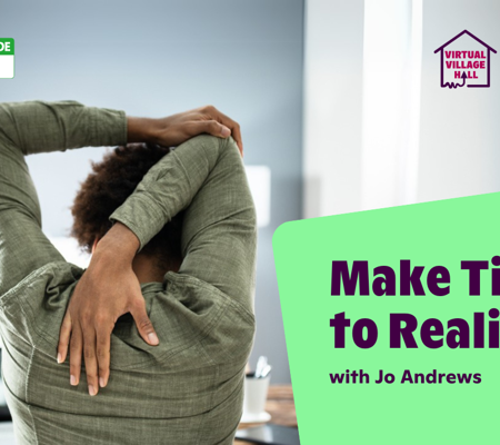 a woman sat at a work desk stretching her arm behind her head and down her back