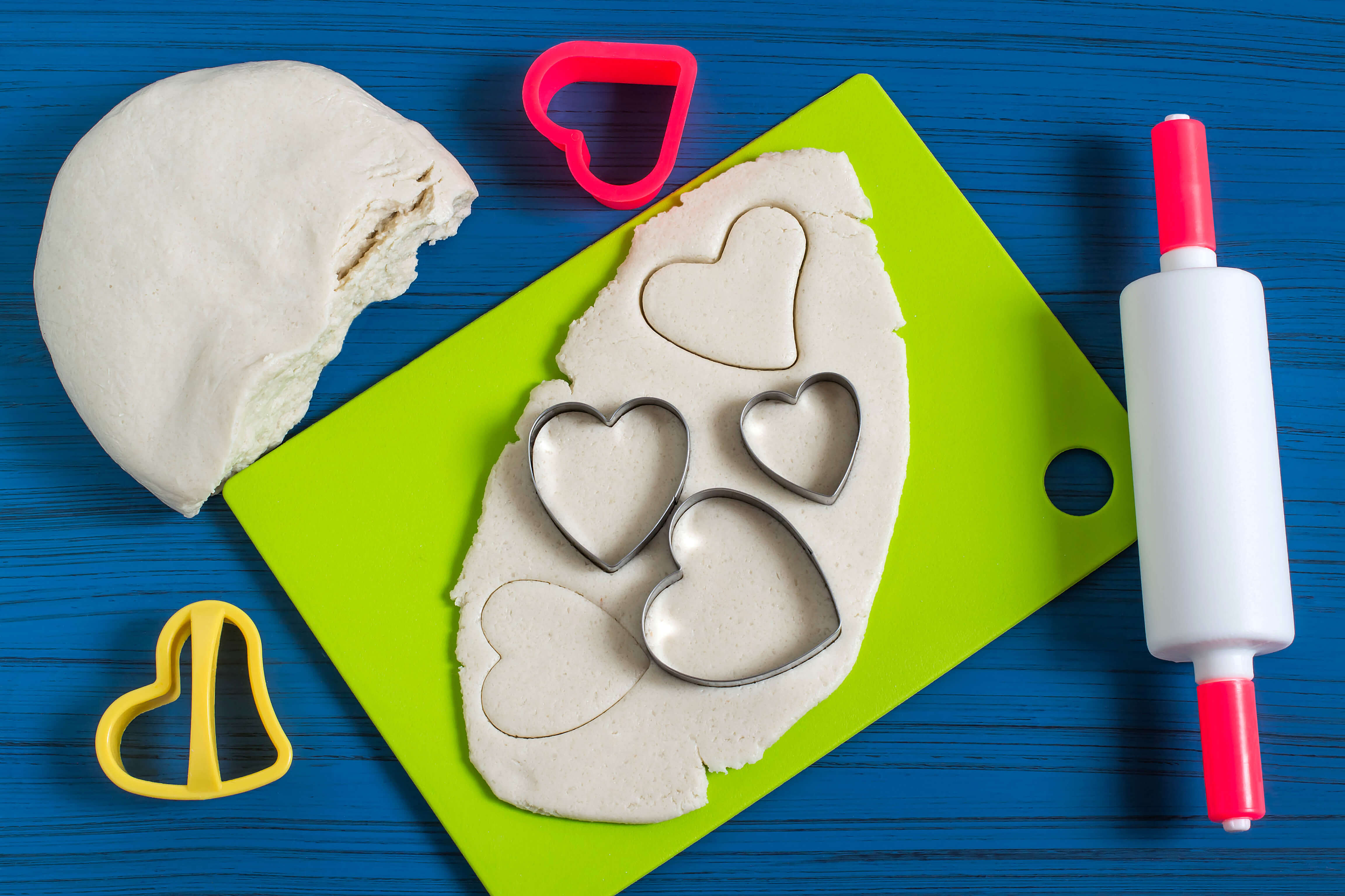 various salt dough making tools on a blue table