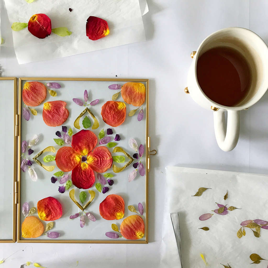 pressed flowers in a glass photo frame