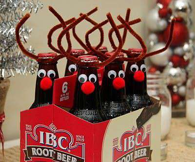 a six pack of beer bottles decorated as reindeer