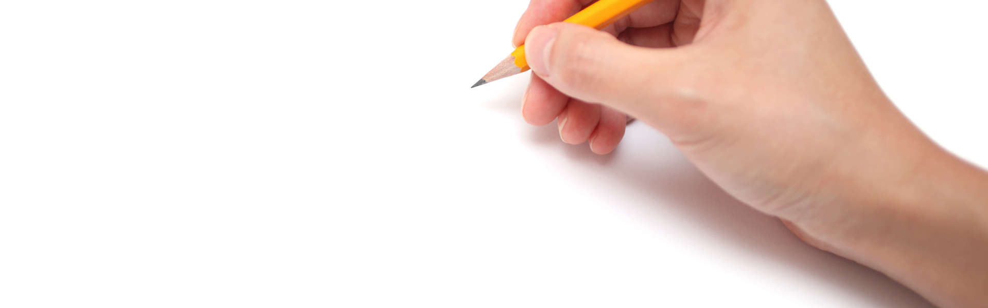 a close up of a hand holding a pencil and drawing