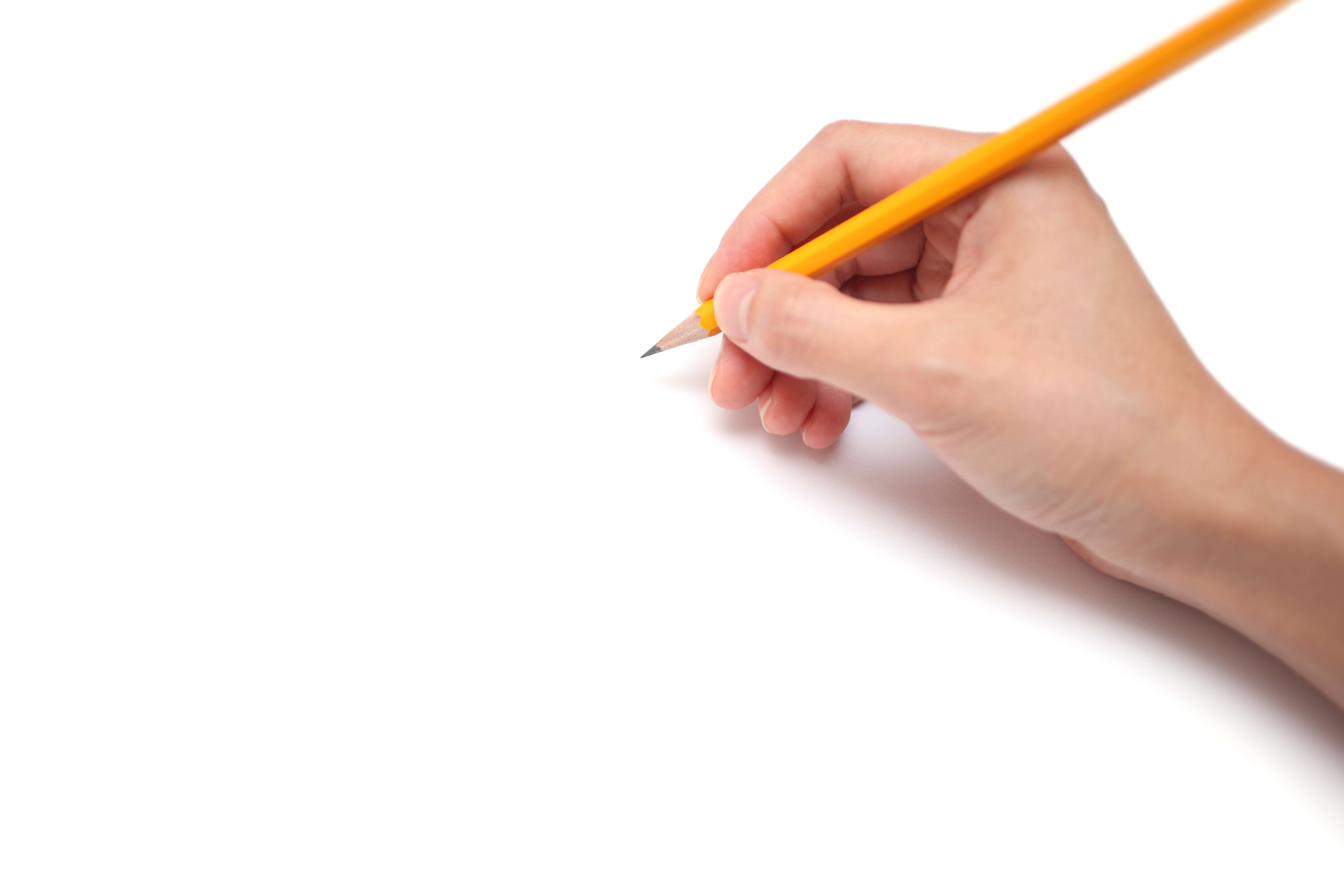 a close up of a hand holding a pencil and drawing