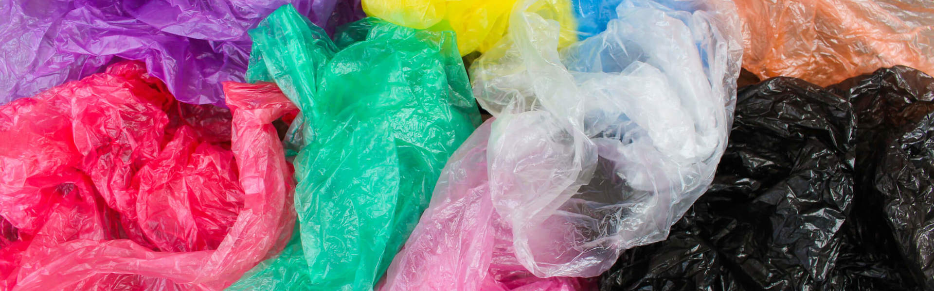 a close up of multicoloured plastic bags