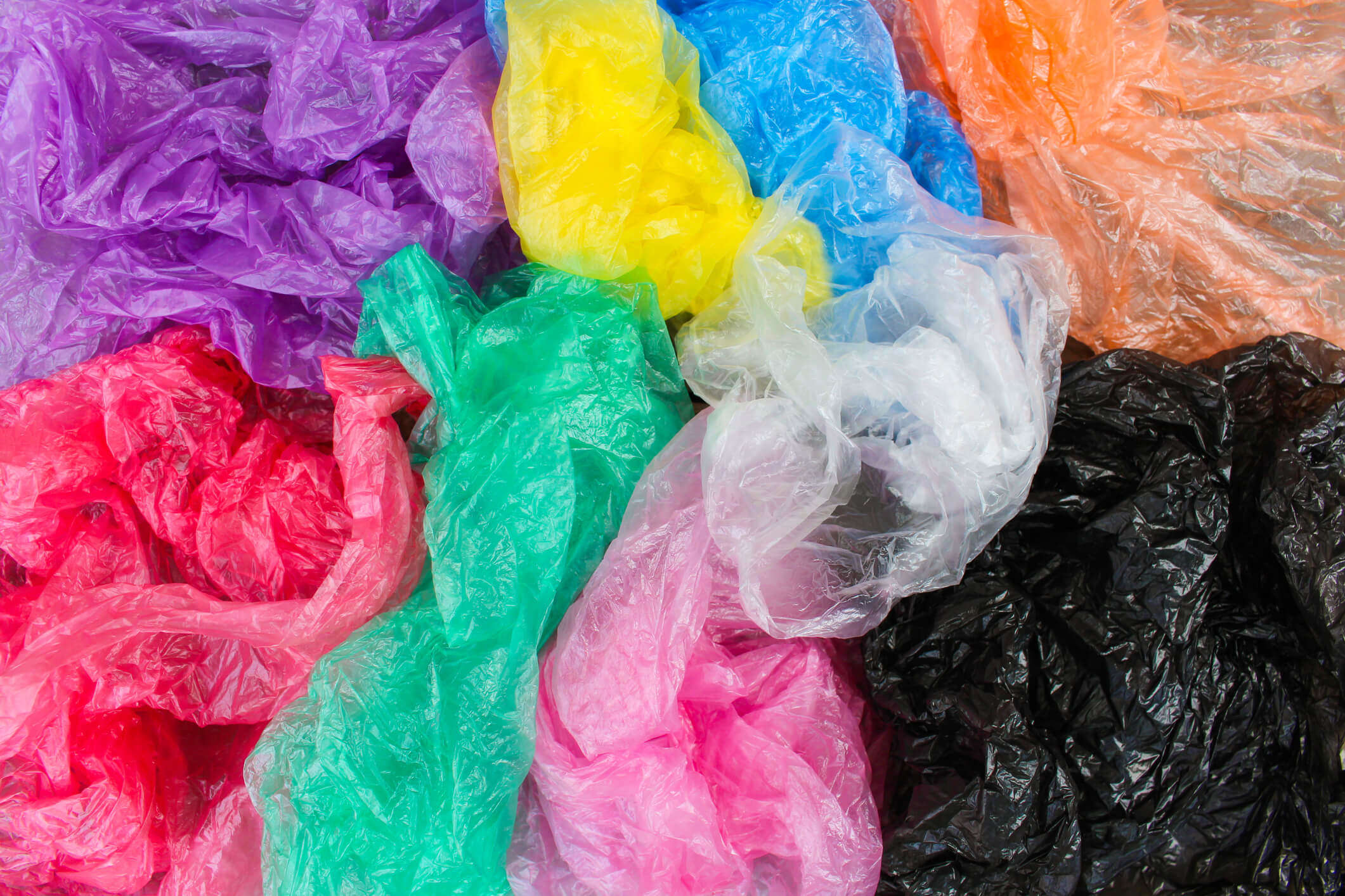 a close up of multicoloured plastic bags