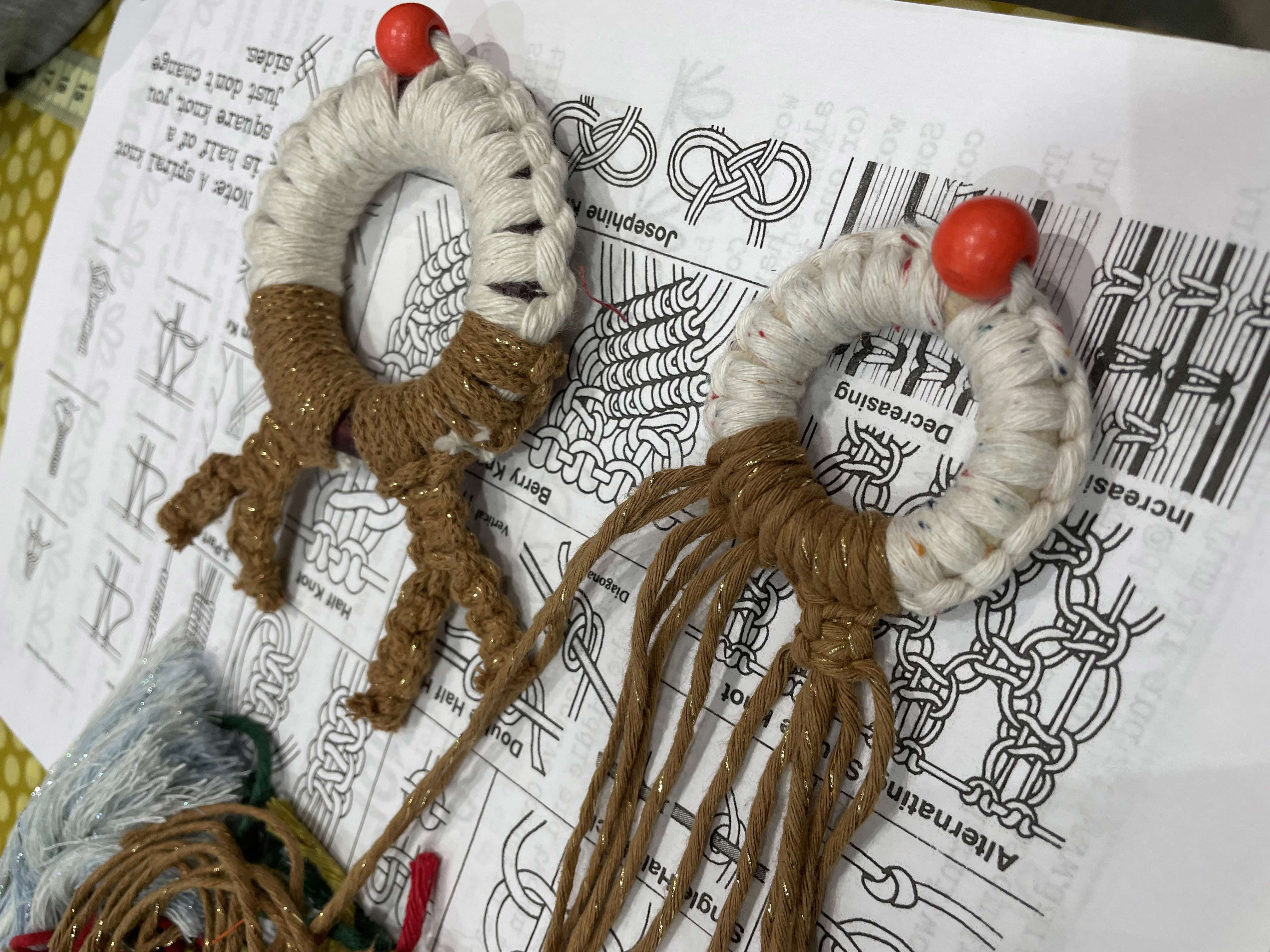 Main image: Macrame wreath reindeer ornament, with brown and white cord, and a red bead nose.