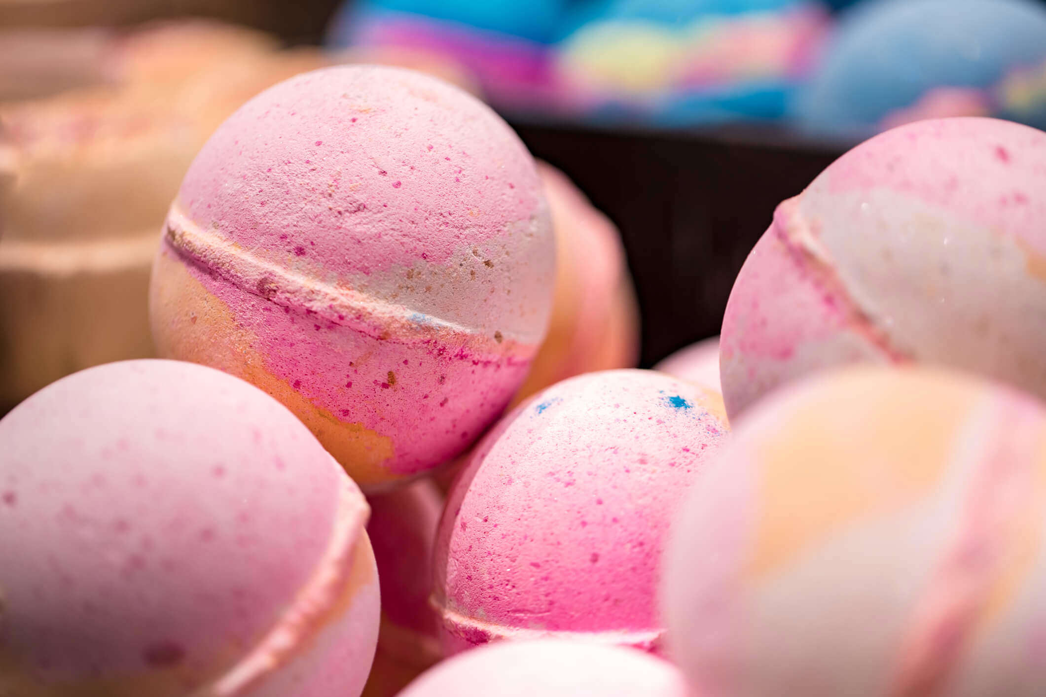 a close up of pink bath bombs