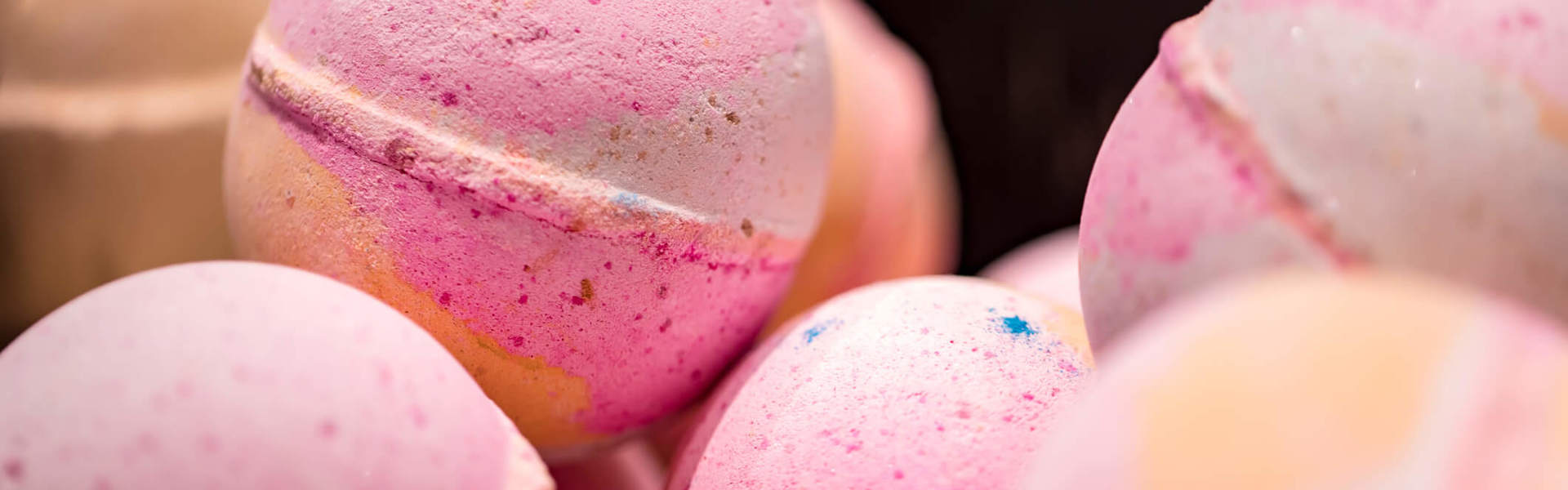 a close up of pink bath bombs