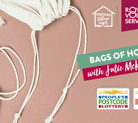 two cream canvas drawstring bags on a brown background
