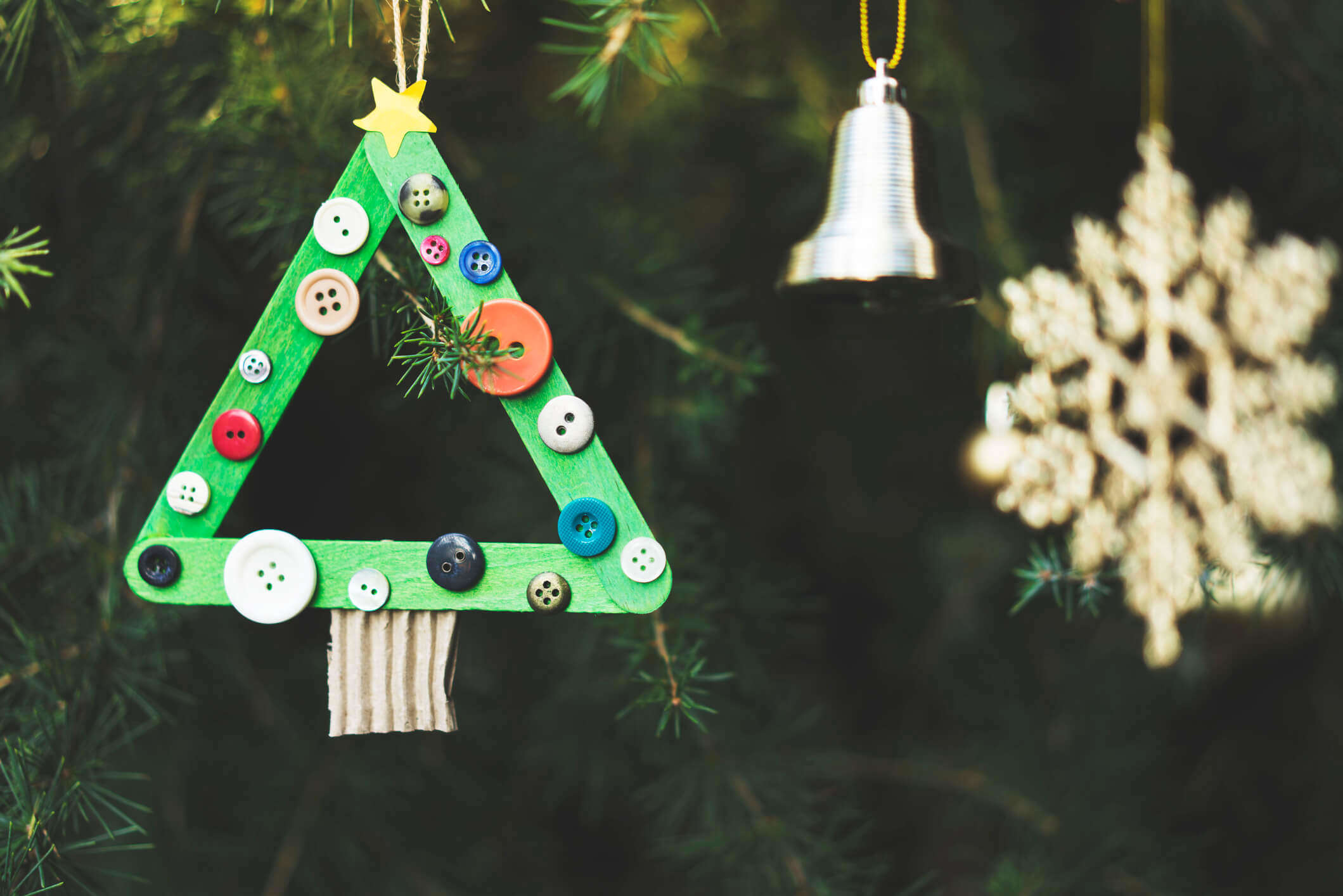 a handmade DIY Christmas decoration hanging on a Christmas tree