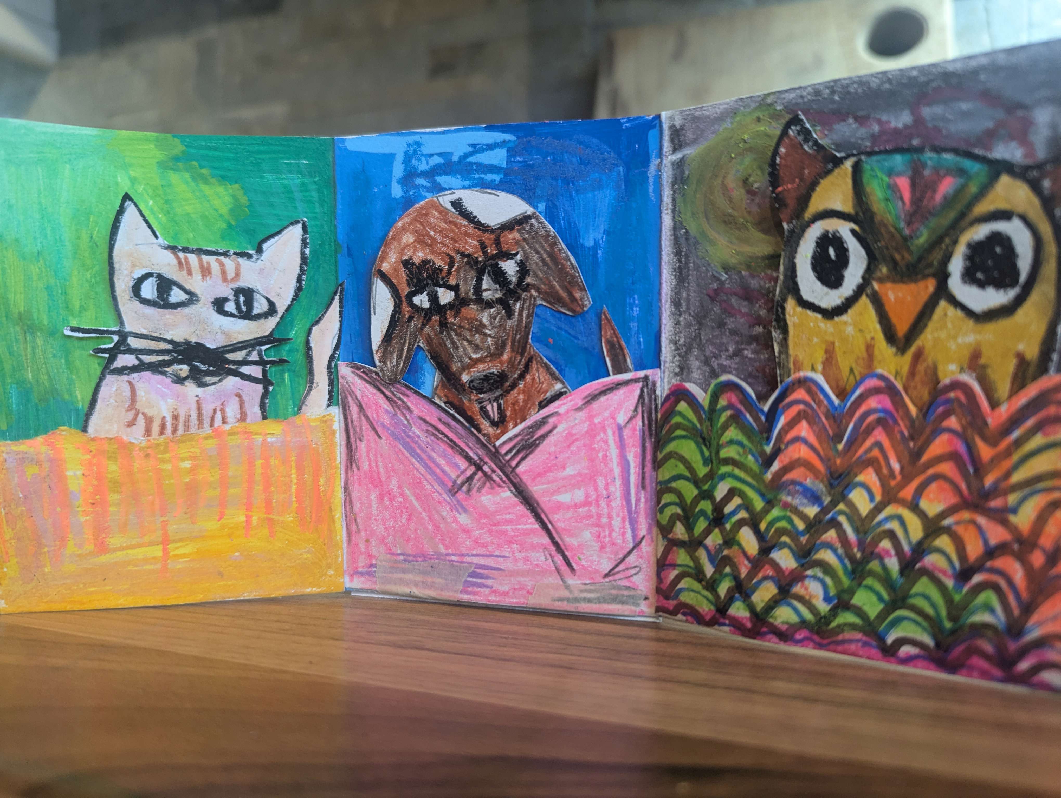 two colourful interaction oil pastel animal cards made by Rosie Johnson