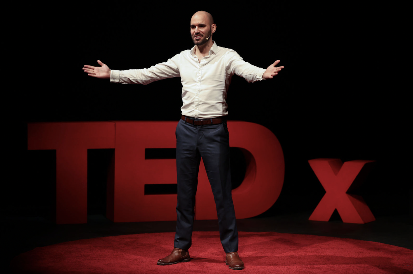 Men's coach Ryan Park on stage at TEDX