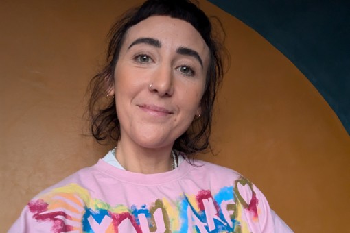 Tutor Rosie wearing her own hand painted t-shirt