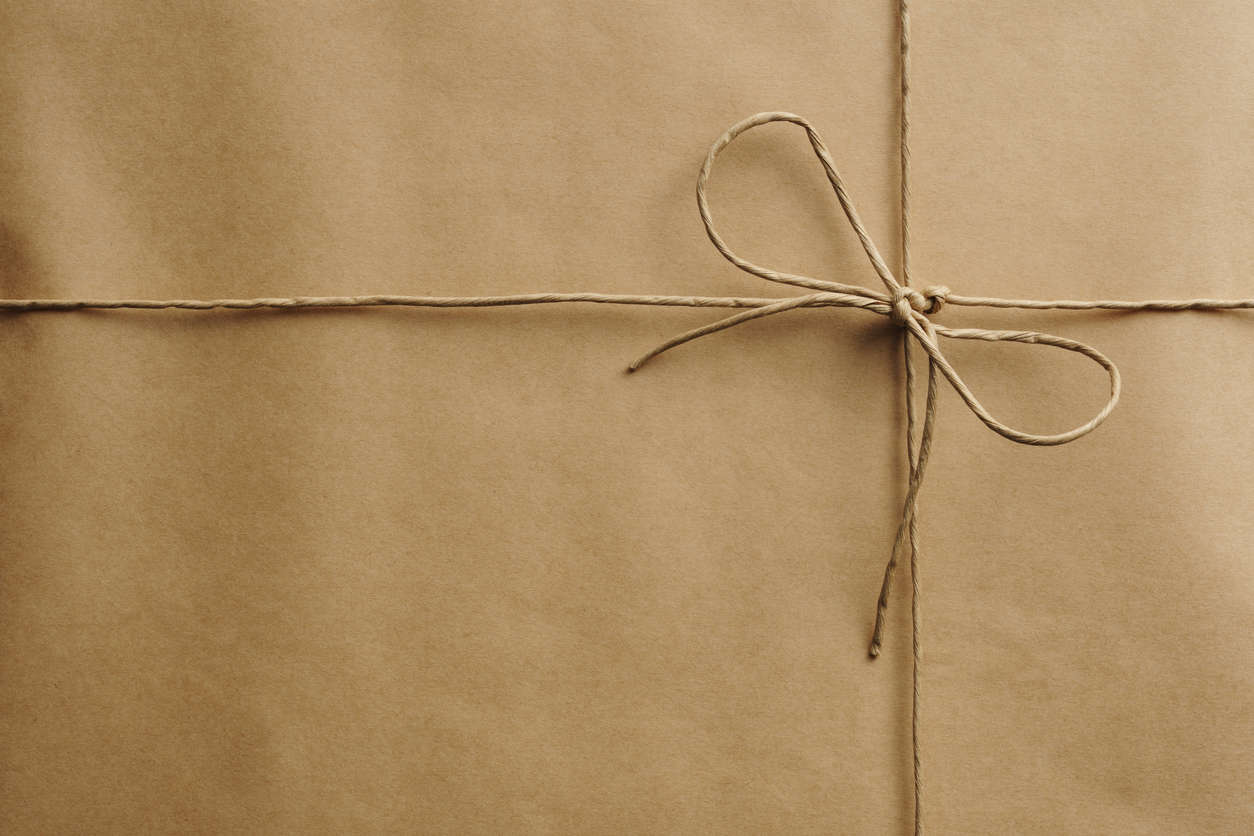 Brown paper wrapped in brown twine in a bow